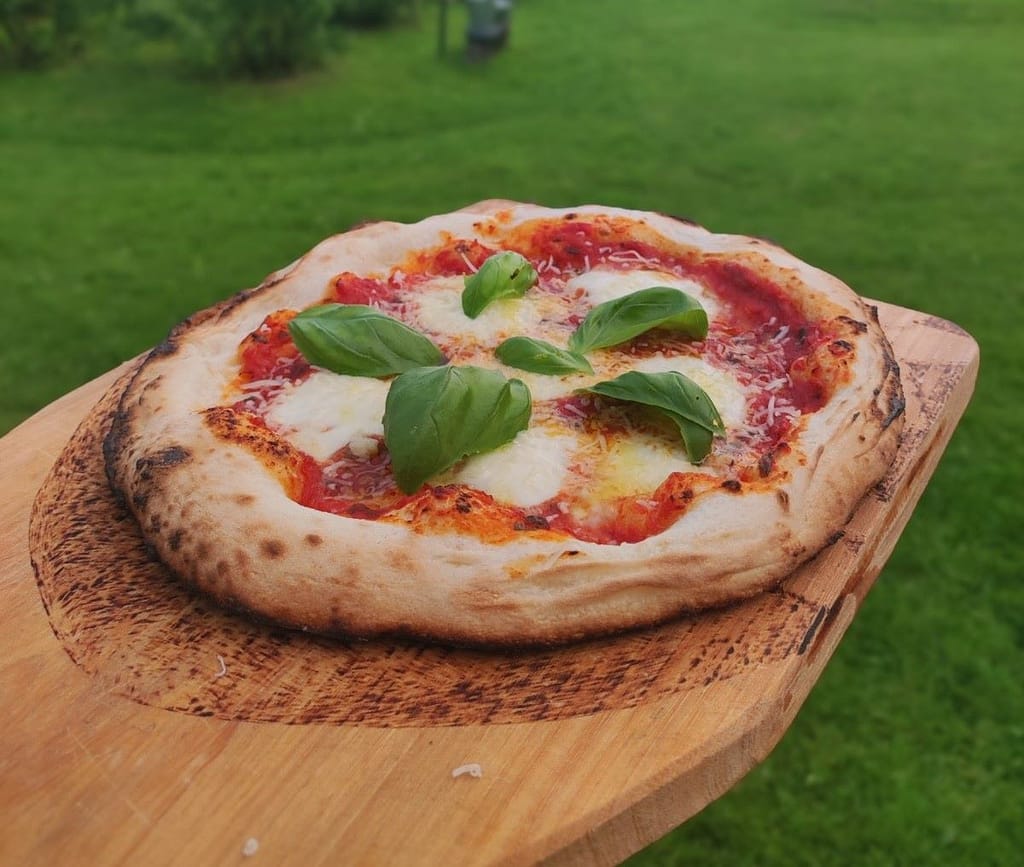 Neapolitan style pizza cooked in a DIY wood fired pizza oven