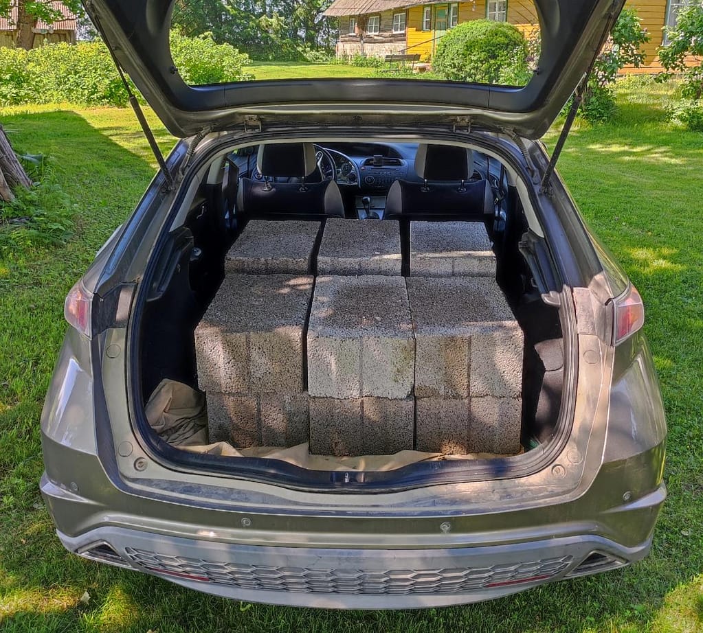 Construction blocks for the pizza oven base can be easily transported in the back of a small car